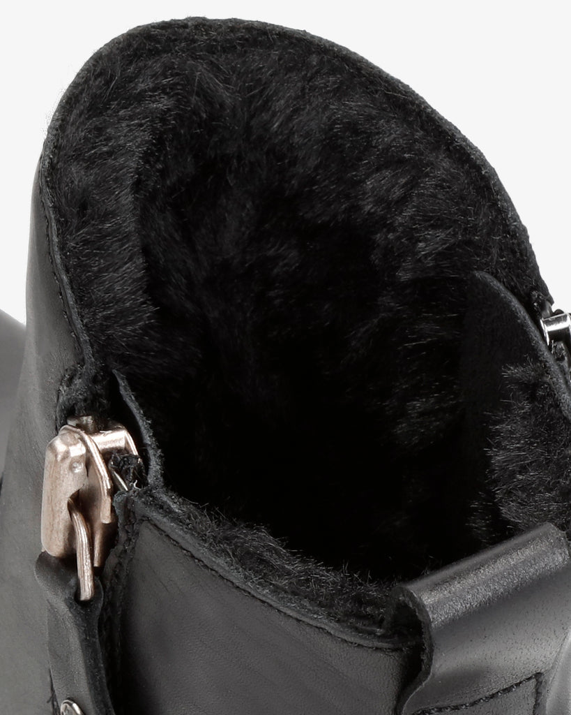 Pauline Trav botines de piel con forro interior de pelo. negro